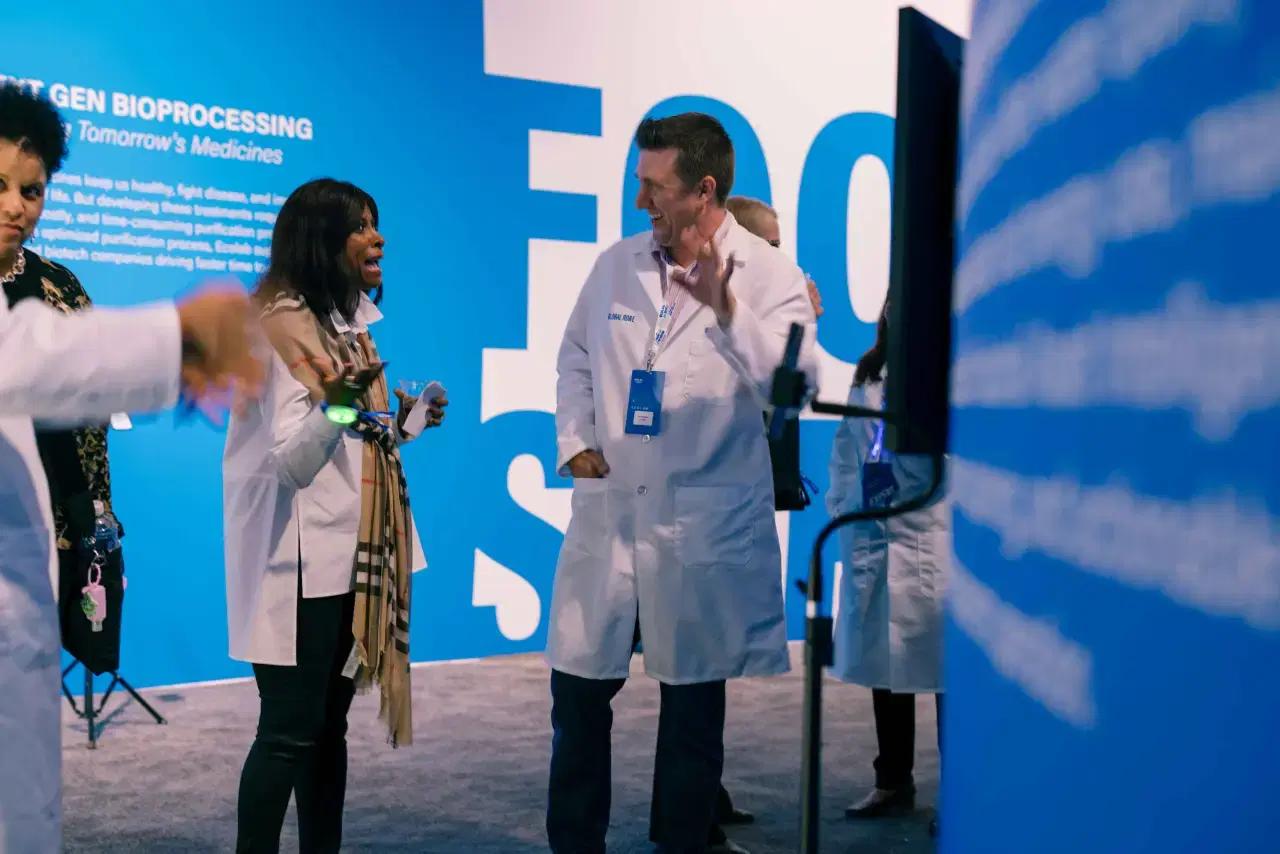 Attendees interacting at branded photo booth activation