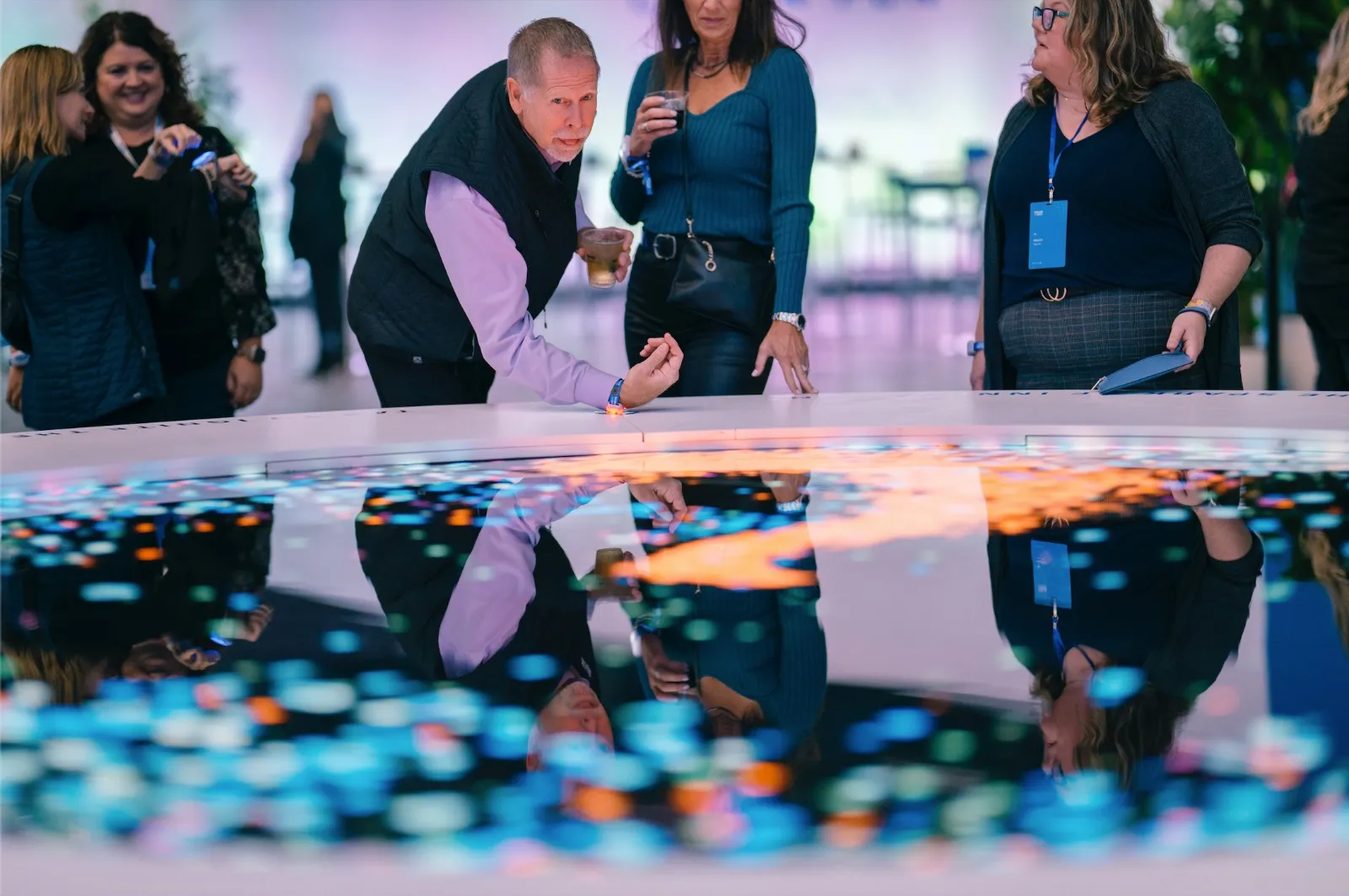 Attendees interacting with the Spark Sculpture at the Ecolab 100 celebration