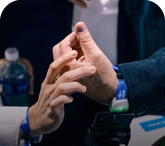 An attendee checking in using an NFC wristband